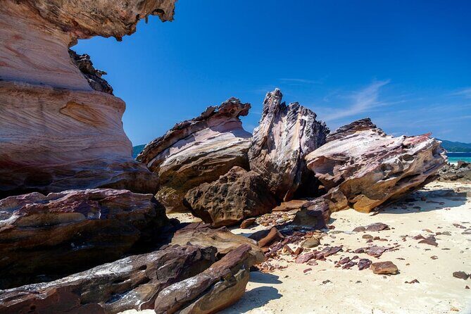 Khai Islands Speedboat Trip Half Day Tour - Khai Nai Island: cat feeding, photos, and beach recovery