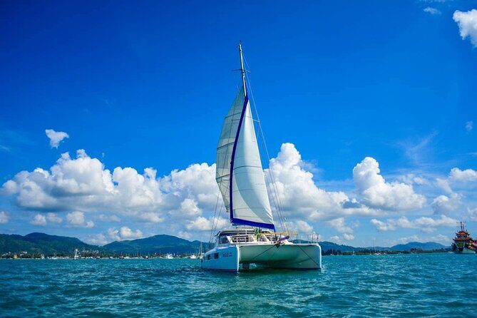 Phuket Catamaran Snorkel & Sunset: Coral & Racha - Racha Yai: the short long-tail transfer and quick beach time